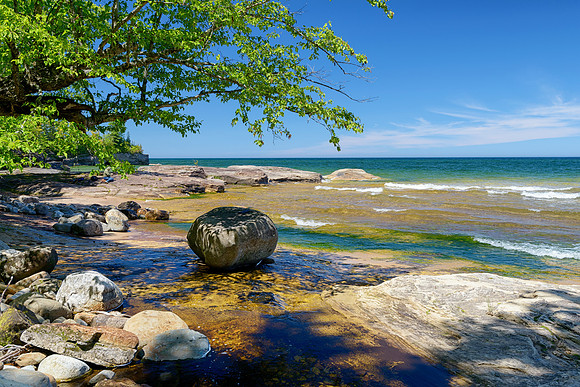 My wife reading her book at Lake Superior
