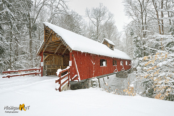 "Snow on a red covered Bridge"