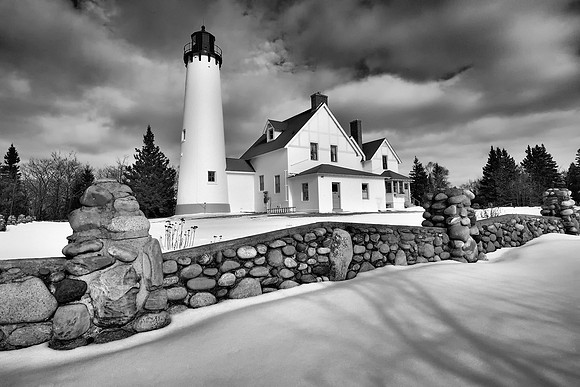 "Point Iroquois Lighthouse on a partly sunne winter day""