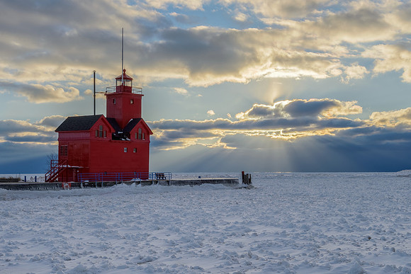 "Sunrays in the clouds at Holland Lighthouse"