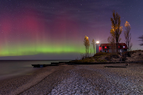Northern Lights at Point Betise Lighthouse on a moonlit night