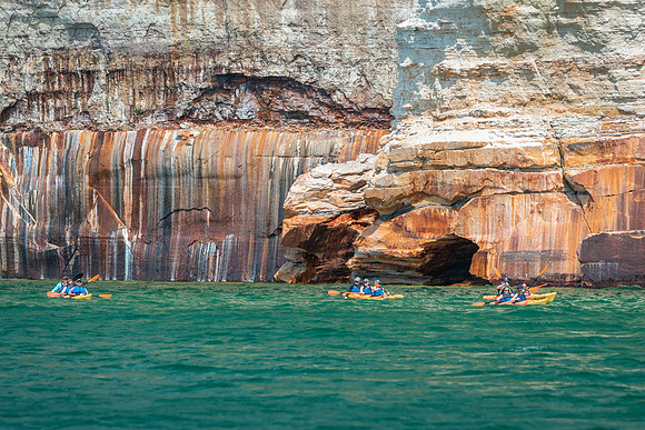 Kayakers in the Painted Rocks part of Pictured Rocks National Lakeshore