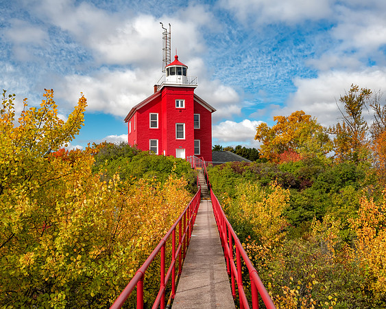 Marquette Harbor Lighthouse framed in fall colors