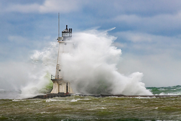Large waves pound the Ludington Lighthouse