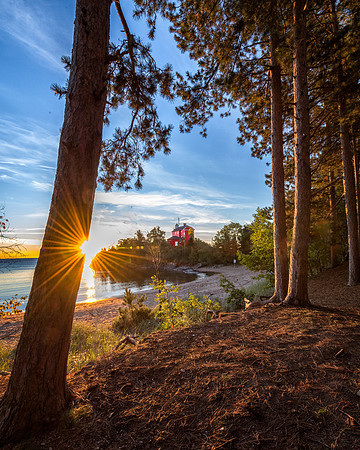 Marquette Harbor Lighthouse Sunrise through Pines